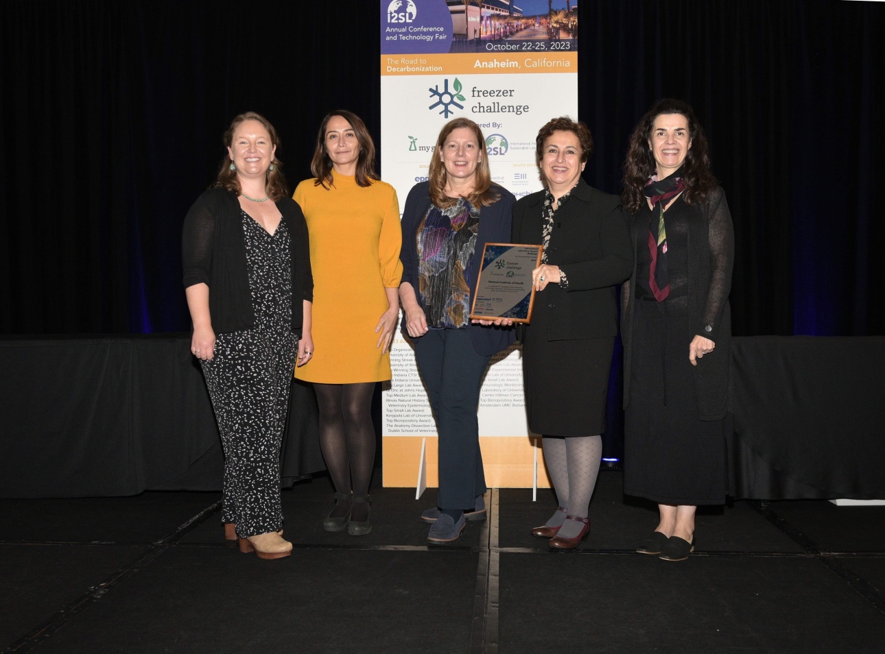 NIH lab poses with award