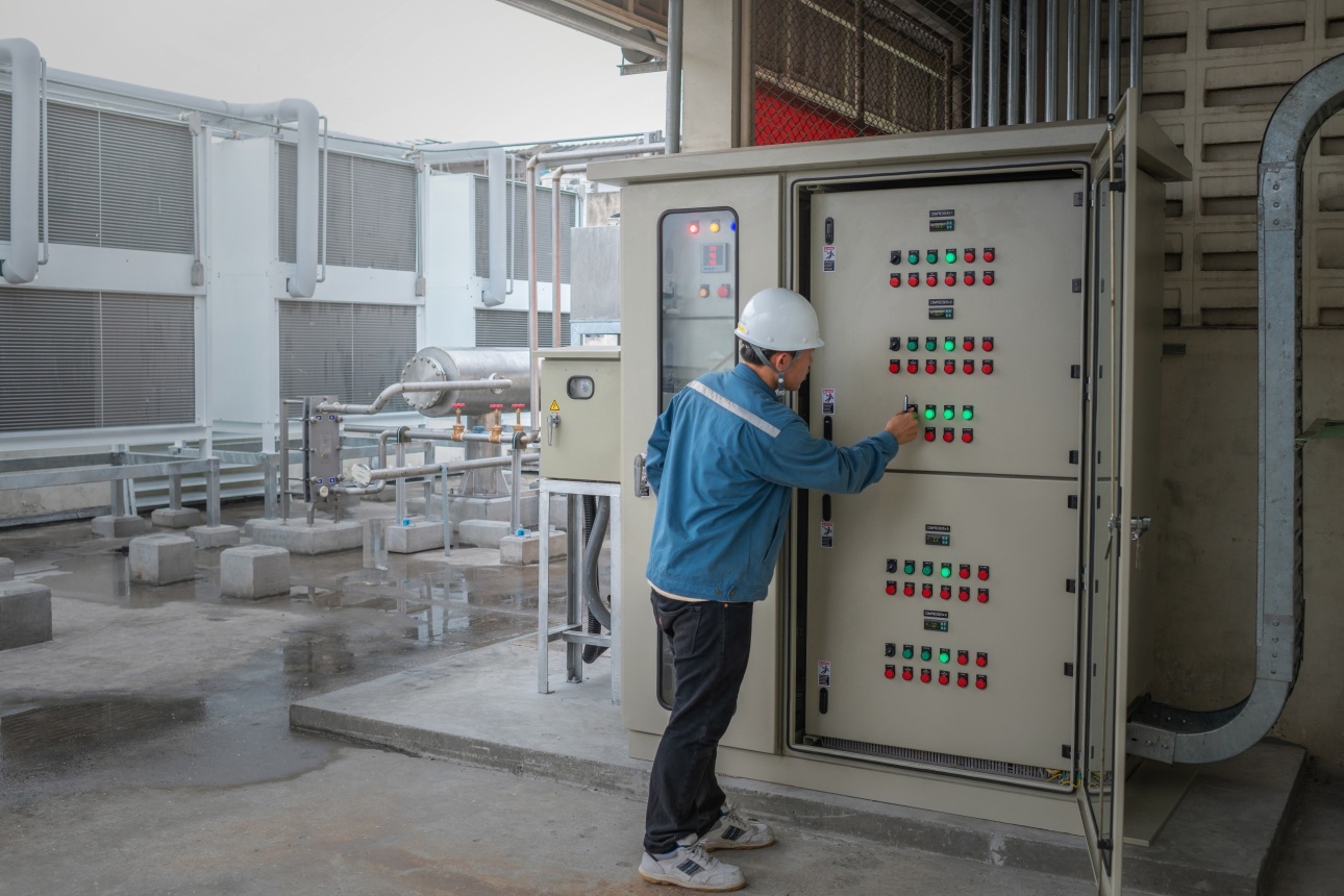energy engineer checking temp of refrigeration